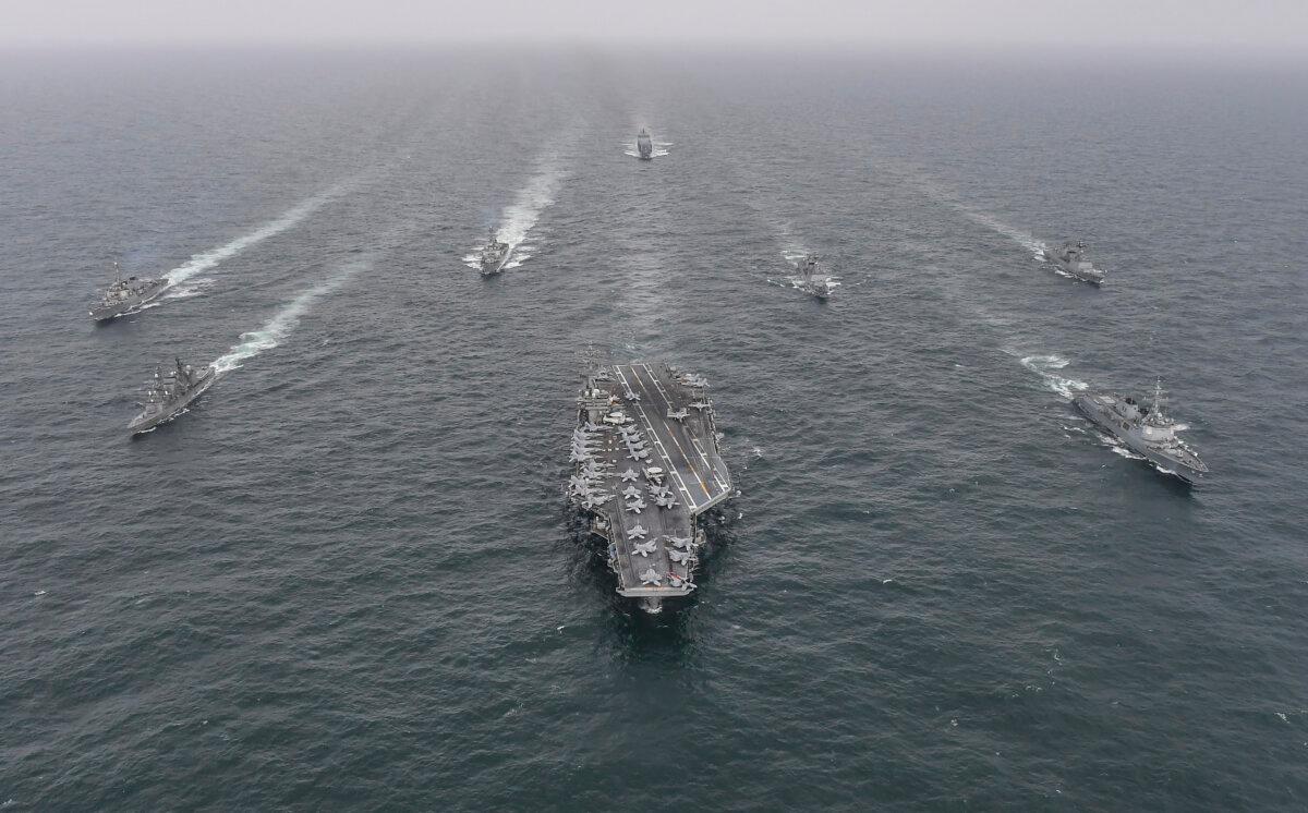 South Korean Navy's destroyer Yulgok Yi I (R) U.S. Navy's aircraft carrier USS Nimitz (C) and Japan Maritime Self-Defense Force's Umigiri sail in formation during a joint naval exercise in international waters off South Korea's southern island of Jeju at an undisclosed location, on April 4, 2023. (South Korean Defense Ministry via Getty Images)