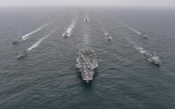 In this handout image released by the South Korean Defense Ministry, South Korean Navy's destroyer Yulgok Yi I (R) U.S. Navy's aircraft carrier USS Nimitz (C) and Japan Maritime Self-Defense Force's Umigiri, (L) sail in formation during a joint naval exercise in international waters off South Korea's southern island of Jeju on April 04, 2023 at an undisclosed location. (South Korean Defense Ministry via Getty Images)