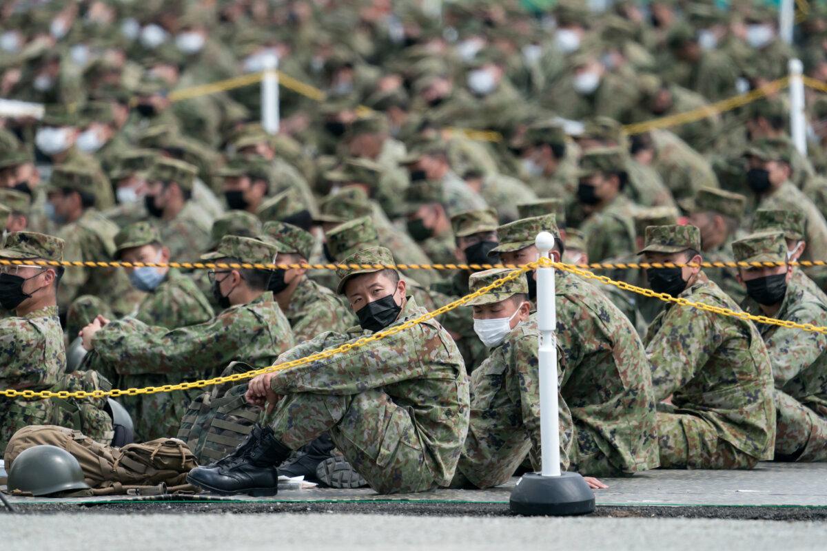 Members of the Japan Ground Self-Defense Force (JGSDF) attend a live fire exercise at East Fuji Maneuver Area in Gotemba, Shizuoka, Japan, on May 28, 2022. (Tomohiro Ohsumi/Getty Images)