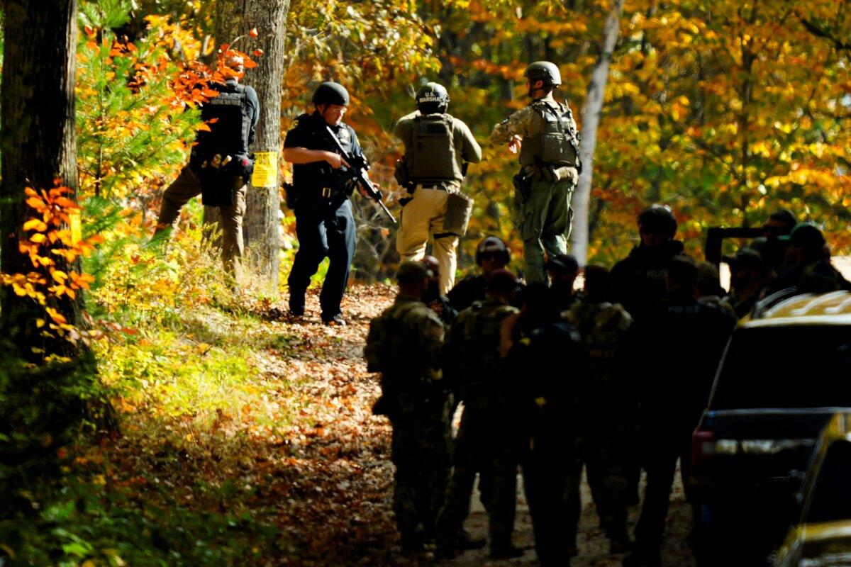 Law enforcement continue a manhunt in the aftermath of a mass shooting, in Durham, Maine on Oct. 27, 2023. (Matt Rourke/AP Photo)