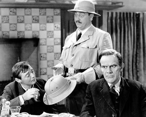 (L–R) Dr. Herman Epstein (Peter Lorre), "Teddy Roosevelt" Brewster (John Alexander), and Jonathan Brewster (Raymond Massey), in “Arsenic and Old Lace.” (Warner Bros.)
