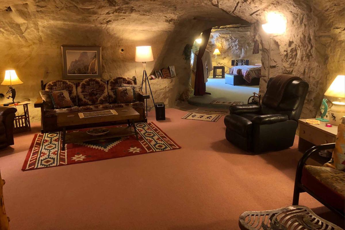 A view of the living room in Koko’s Cave domicile in New Mexico. (Courtesy of <a href="https://kokoscave.us/">Kokopelli’s Cave</a>)
