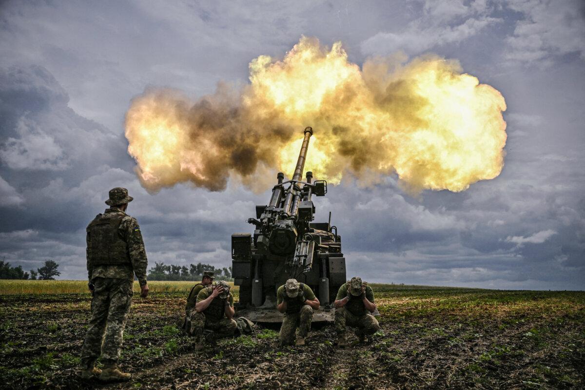 Ukrainian servicemen fire with a French self-propelled 155 mm/52-calibre gun Caesar towards Russian positions at a front line in the eastern Ukrainian region of Donbas on June 15, 2022. (Aris Messinis/AFP via Getty Images)