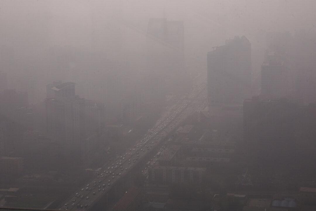 Haze Lingers in Beijing as Fog Blankets Parts of North China