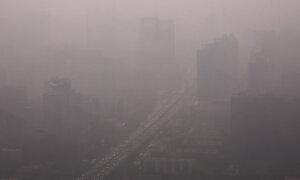 Haze Lingers in Beijing as Fog Blankets Parts of North China