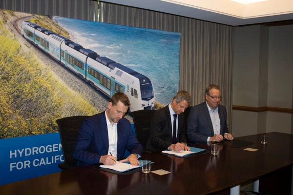 Officials sign a historic $80 million contract for the first zero-emission, hydrogen-powered intercity passenger trains in North America. (Courtesy of Caltrans)