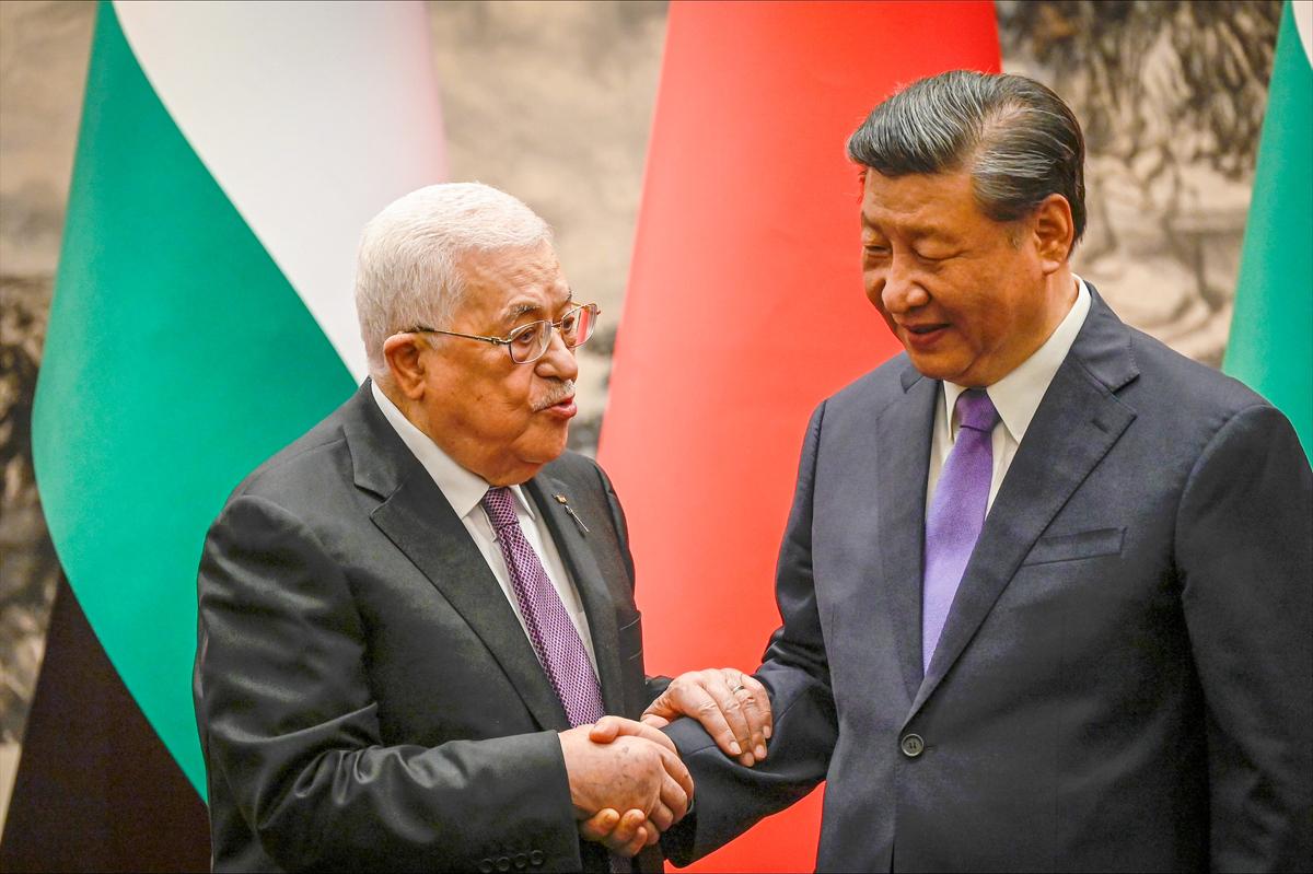  Palestinian President Mahmud Abbas shakes hands with China’s President Xi Jinping after a signing ceremony at the Great Hall of the People in Beijing on June 14, 2023. (Jade Gao-Pool/Getty Images)
