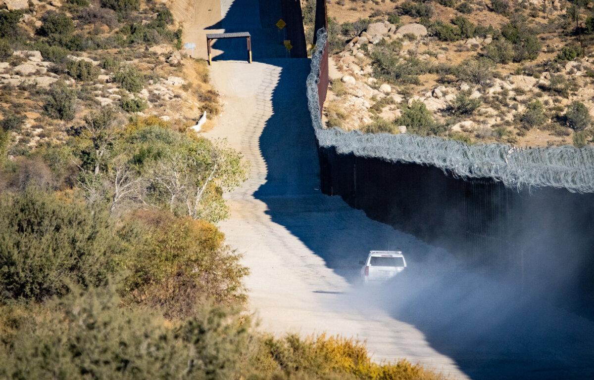 A border patrol agent drives at high speeds to track smugglers along the U.S. border wall in Jacumba, Calif., on Oct. 31, 2023. (John Fredricks/The Epoch Times)