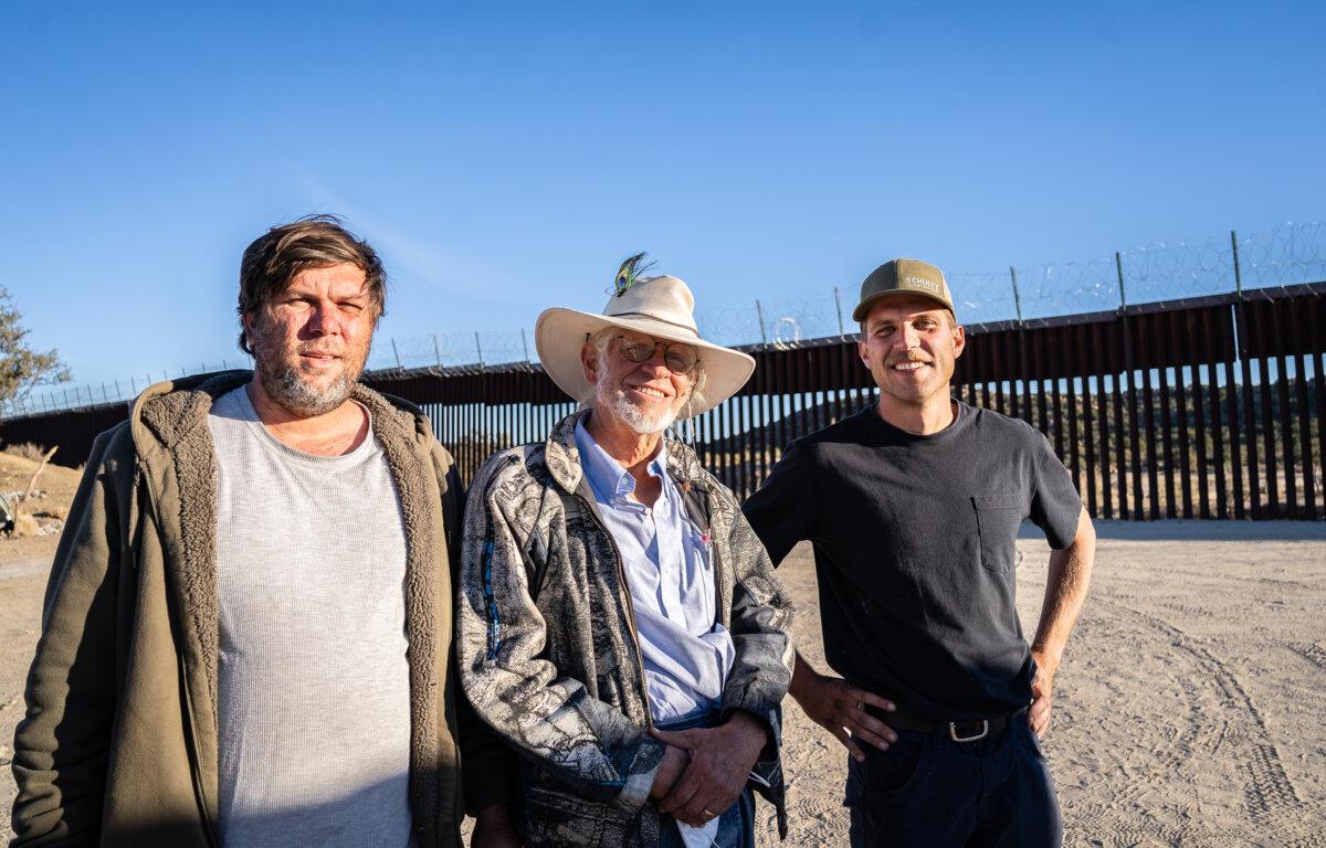 (L to R) Nick, Samuel, and John Schultz volunteer together to feed migrants a hot meal in Jacumba, Calif., on Oct. 31, 2023. (John Fredricks/The Epoch Times)