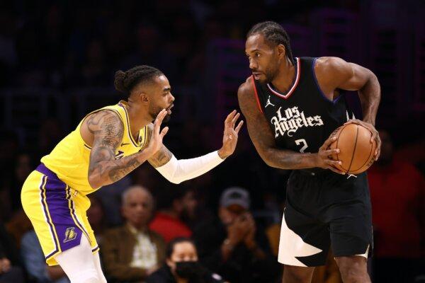 Kawhi Leonard (2) of the Los Angeles Clippers handles the ball against D'Angelo Russell (1) of the Los Angeles Lakers during the first quarter in Los Angeles on Nov. 1, 2023. (Katelyn Mulcahy/Getty Images)