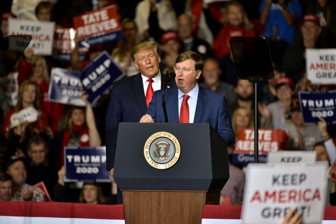 Then-Mississippi Republican gubernatorial candidate Tate Reeves (R) speaks alongside President Donald Trump during a campaign rally in Tupelo, Miss., on Nov. 1, 2019. (Brandon Dill/Getty Images)