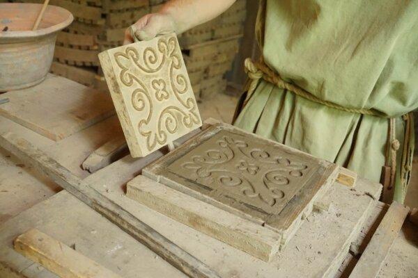 A counter-relief tile after a pattern has been pressed into clay, a technique that began in the 11th century. (Copyright Guédelon)