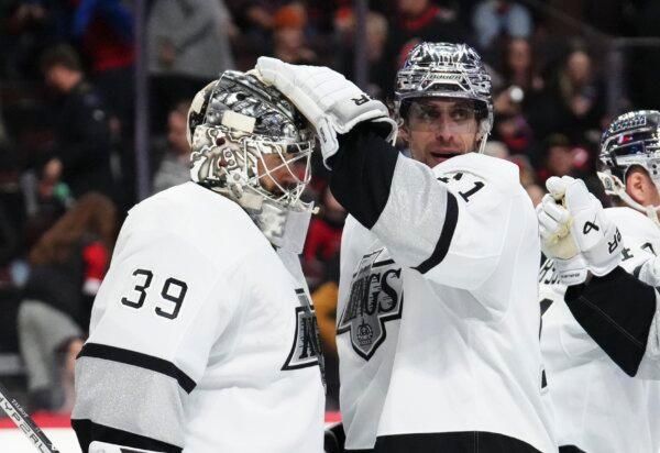 Los Angeles Kings centre Anze Kopitar (11) gives goaltender Cam Talbot (39) a pat on the head after the team's win over the Ottawa Senators in an NHL hockey game in Ottawa, Ontario, on Nov. 2, 2023. (Sean Kilpatrick/The Canadian Press via AP)