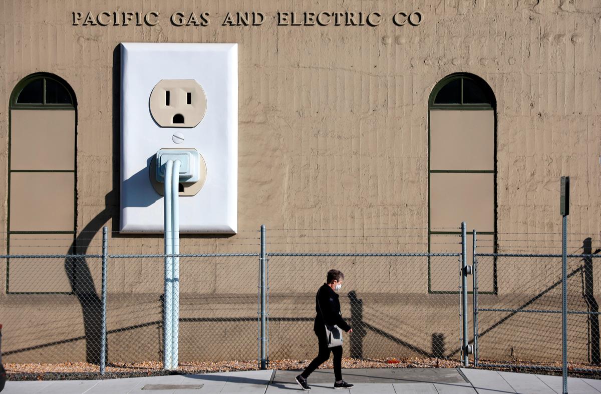  A pedestrian walks by a Pacific Gas & Electric electrical substation in Petaluma, Calif., on Jan. 26, 2022. The Department of Homeland Security has warned that domestic extremists have been developing specific plans to target electrical infrastructure in the United States. (Justin Sullivan/Getty Images)