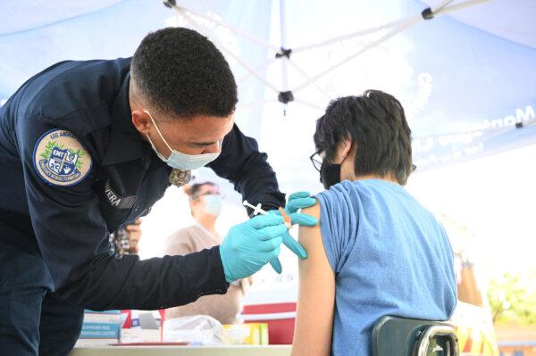 A person receives a COVID-19 vaccine in Los Angeles, Calif., on Aug. 23, 2021. (Robyn Beck/AFP via Getty Images)