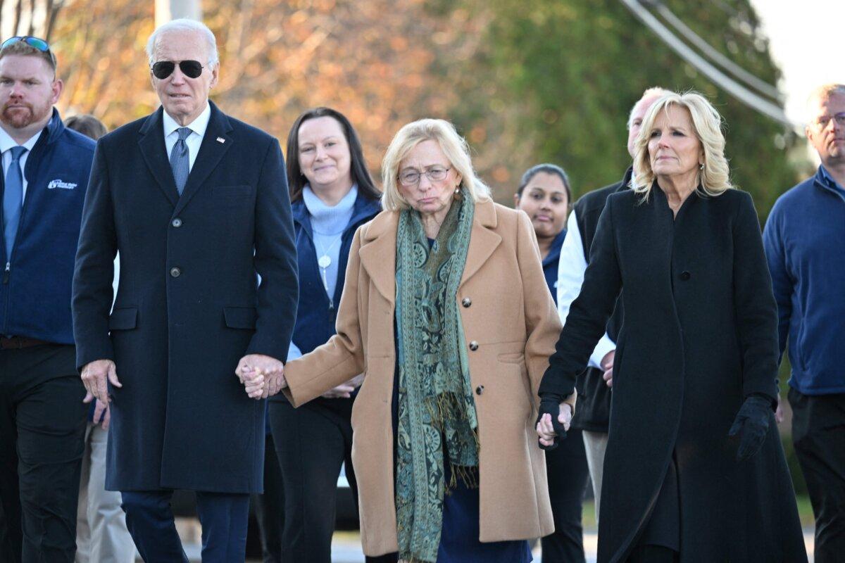 President Joe Biden and First Lady Jill Biden walk with Maine Gov. Janet Mills in Lewiston, Maine, on Nov. 3, 2023, following a mass shooting on Oct. 25. (Mandel Ngan/AFP via Getty Images)