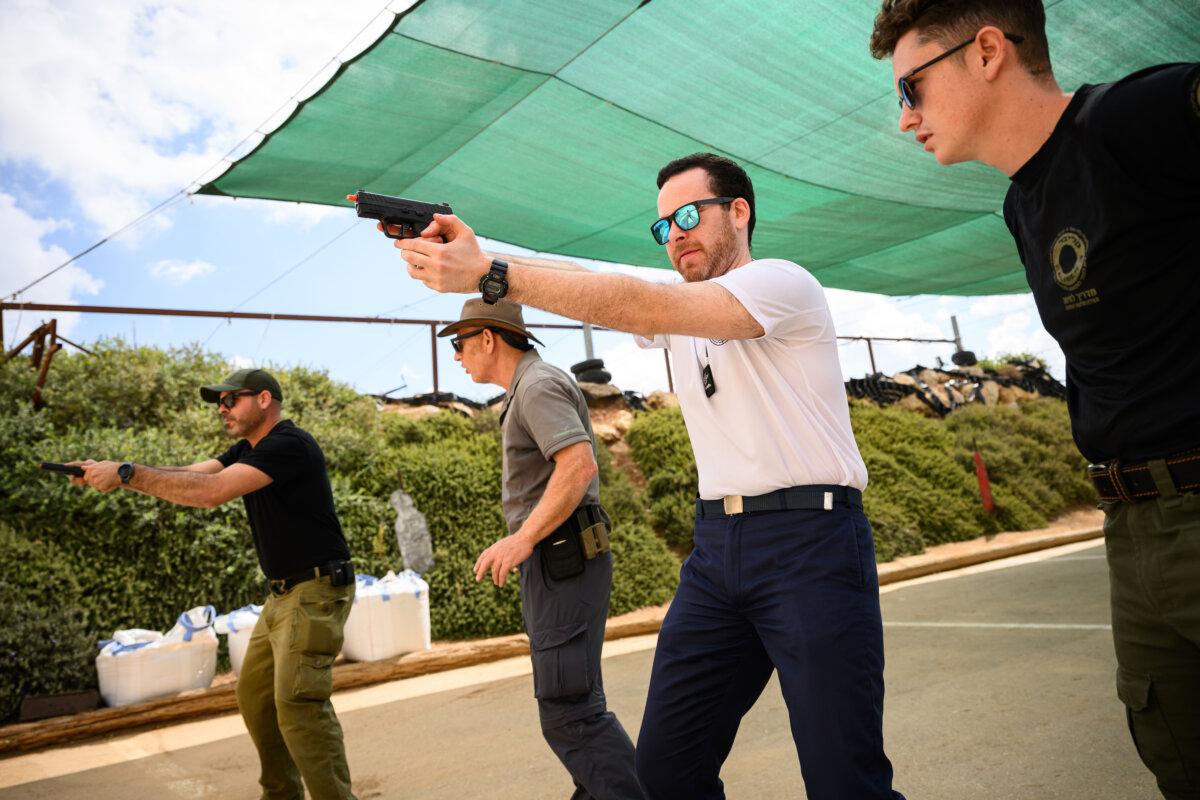Members of the public receive weapons training at the Caliber 3 shooting range, in Efrat, Israel, on Oct. 15, 2023. (Leon Neal/Getty Images)