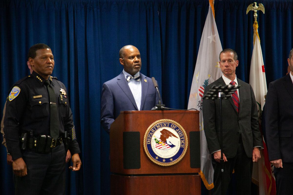 U.S. Attorney of California Northern District of California, Ismail J. Ramsey speaks at the ‘All Hands on Deck’ initiative to crack down on San Francisco’s open drug market. He is joined by SFPD Chief Bill Scott (L) and FBI special agent Robert K. Tripp (R) on Nov 2 in San Francisco, Calif. (Lear Zhou/The Epoch Times)