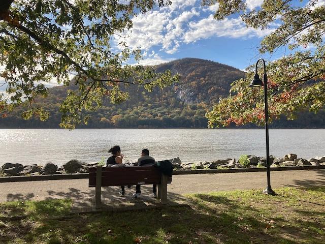 A couple enjoys a warm late-October afternoon on the Hudson River in Cold Spring, New York. (John Haughey/The Epoch Times)