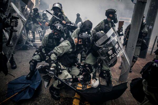 Police tackle and arrest pro-democracy protesters during clashes in Wan Chai in Hong Kong on Oct. 1, 2019. (Chris McGrath/Getty Images)