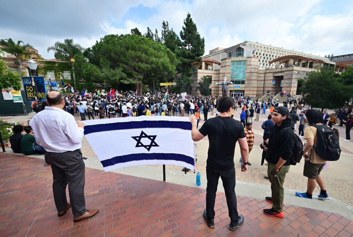 Two men display a flag of Israel as students participate in a pro-Palestinian walkout at Bruin Plaza at the University of California–Los Angeles on Oct. 25, 2023. (Frederic J. Brown/AFP via Getty Images)