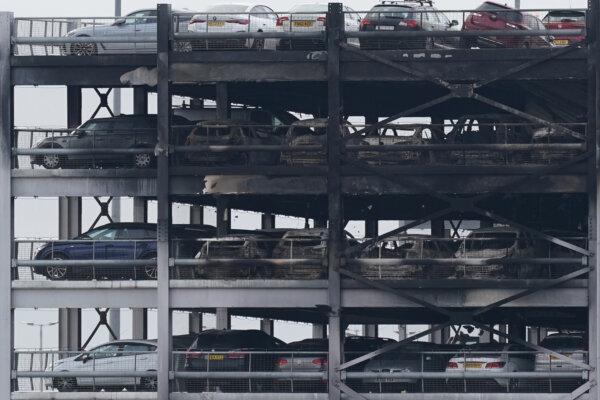 Burnt out shells of cars at a multi-storey car park at Luton Airport in Luton, Bedfordshire, England, on Oct. 11, 2023. (Jacob King/PA Wire)