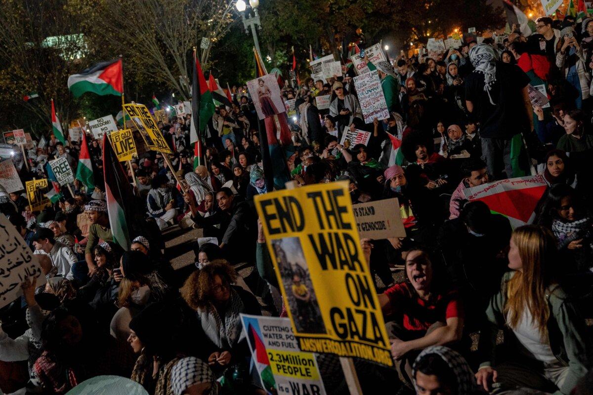 Demonstrators stage a sit-in on Pennsylvania Avenue in front of the White House during a pro-Palestinian rally on Nov. 4, 2023. (Stefani Reynolds/AFP via Getty Images)