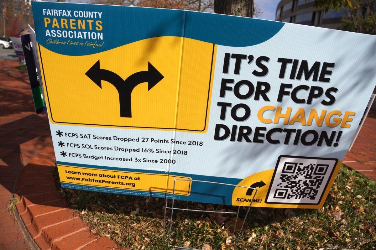 "It's time for FCPS to change direction," says a sign by the Fairfax County Parents Association, outside the Fairfax County Government Center in Fairfax, Va., on Nov. 4, 2023. (Terri Wu/The Epoch Times)