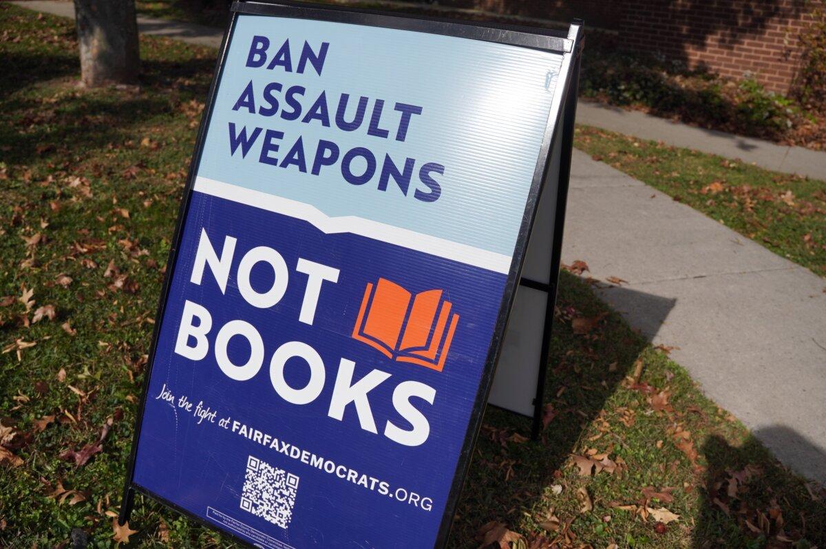 "Ban assault weapons, not books," says a sign outside the Tysons-Pimmit Regional Library, one of the in-person early voting sites, in Falls Church, Va., on Nov. 4, 2023. (Terri Wu/The Epoch Times)