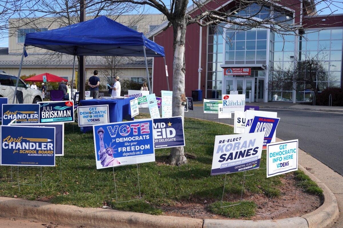 Democrat campaign signs outside the Claude Moore Recreation Center, one of the early in-person voting sites, in Sterling, Va., on Nov. 4, 2023. (Terri Wu/The Epoch Times)