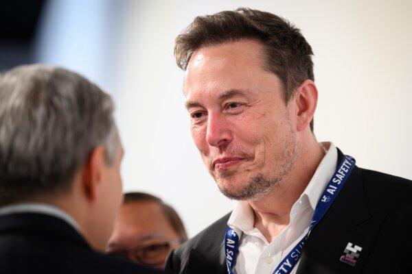 Elon Musk speaks with other delegates during day one of the AI Safety Summit at Bletchley Park in Bletchley, England, on Nov. 1, 2023. (Leon Neal/Getty Images)