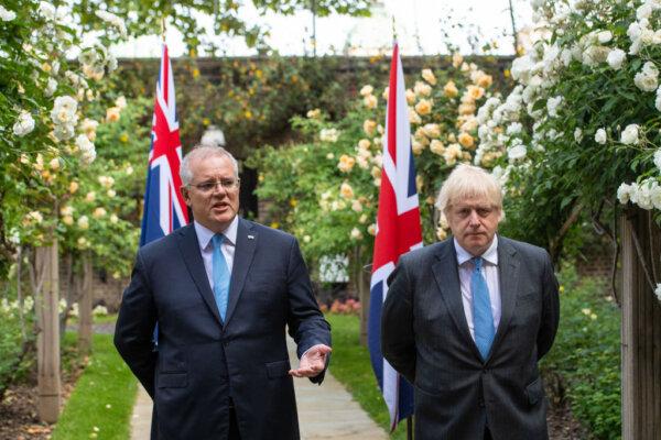 Former UK Prime Minister Boris Johnson (R) and former Australian Prime Minister Scott Morrison in the garden of 10 Downing Street, after agreeing the broad terms of a free trade deal between the UK and Australia, in London, England, on June 15, 2021. (Dominic Lipinski - WPA Pool/Getty Images)