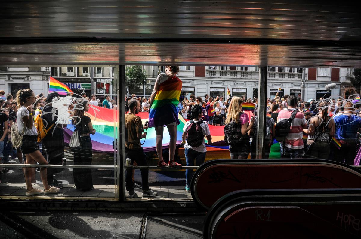 People holding a huge rainbow flag take part in a "gay pride" parade in Belgrade, Serbia, on Sept. 18, 2016. (OLIVER BUNIC/AFP via Getty Images)