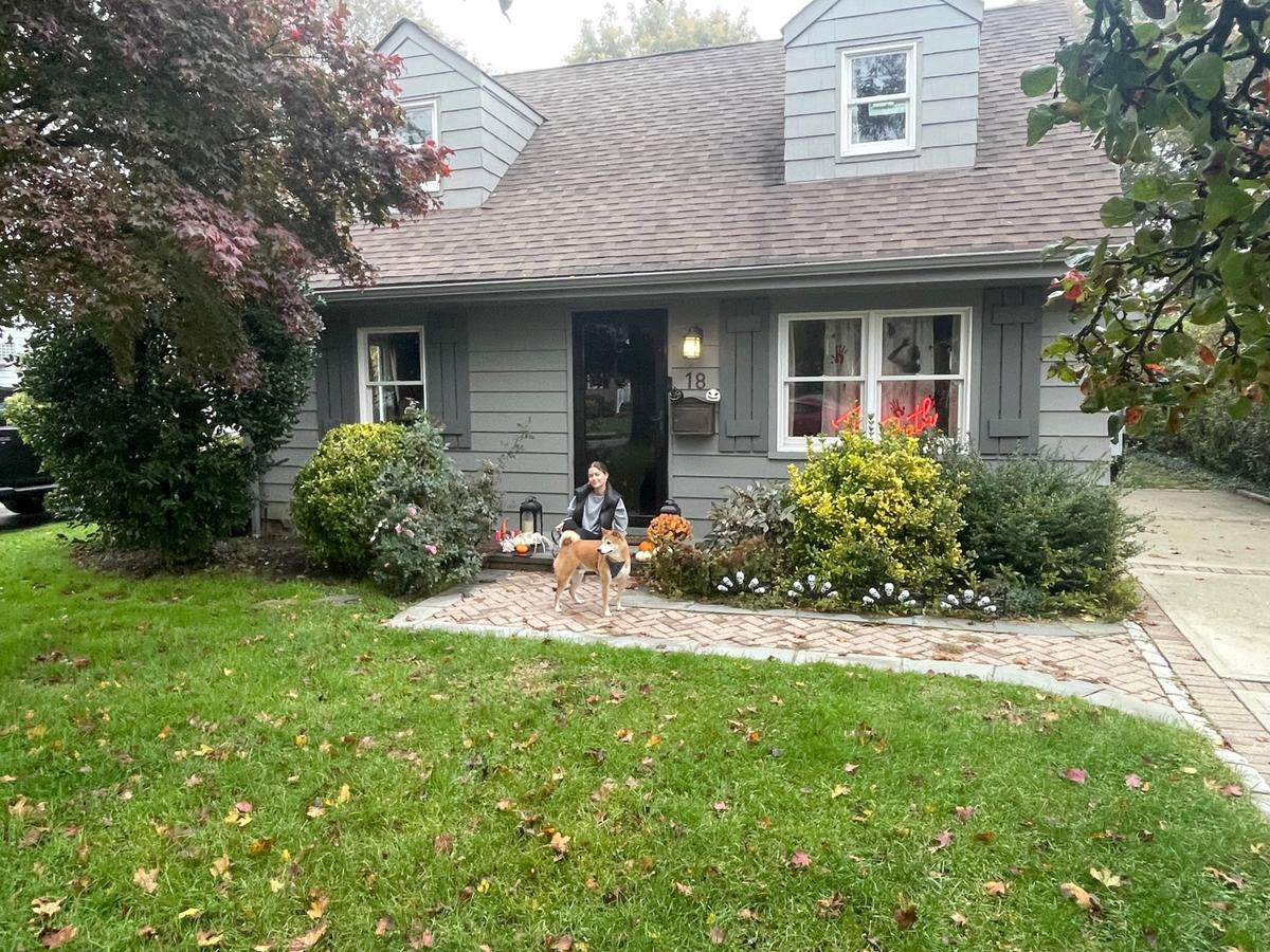Bianca Fabian and her dog outside her new home on Long Island, N.Y. (Courtesy of Bianca Fabian)
