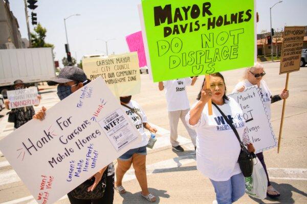 Mobile home residents and their supporters protest outside of Carson City Hall in Carson, Calif., on July 15, 2021. (Patrick T. Fallon/AFP via Getty Images)