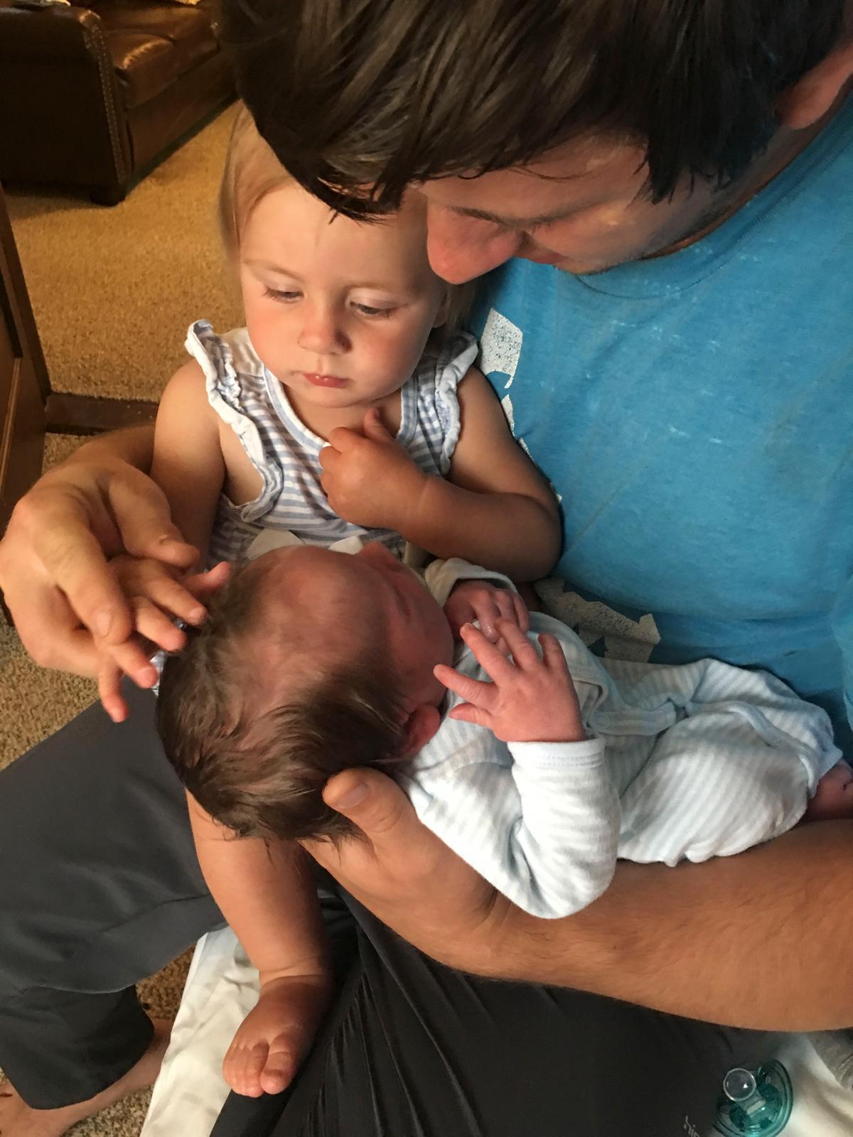 Mr. Shrock introduces Charlette to her baby brother, Charles, on the same day he was born. (Courtesy of Mariah Shrock)