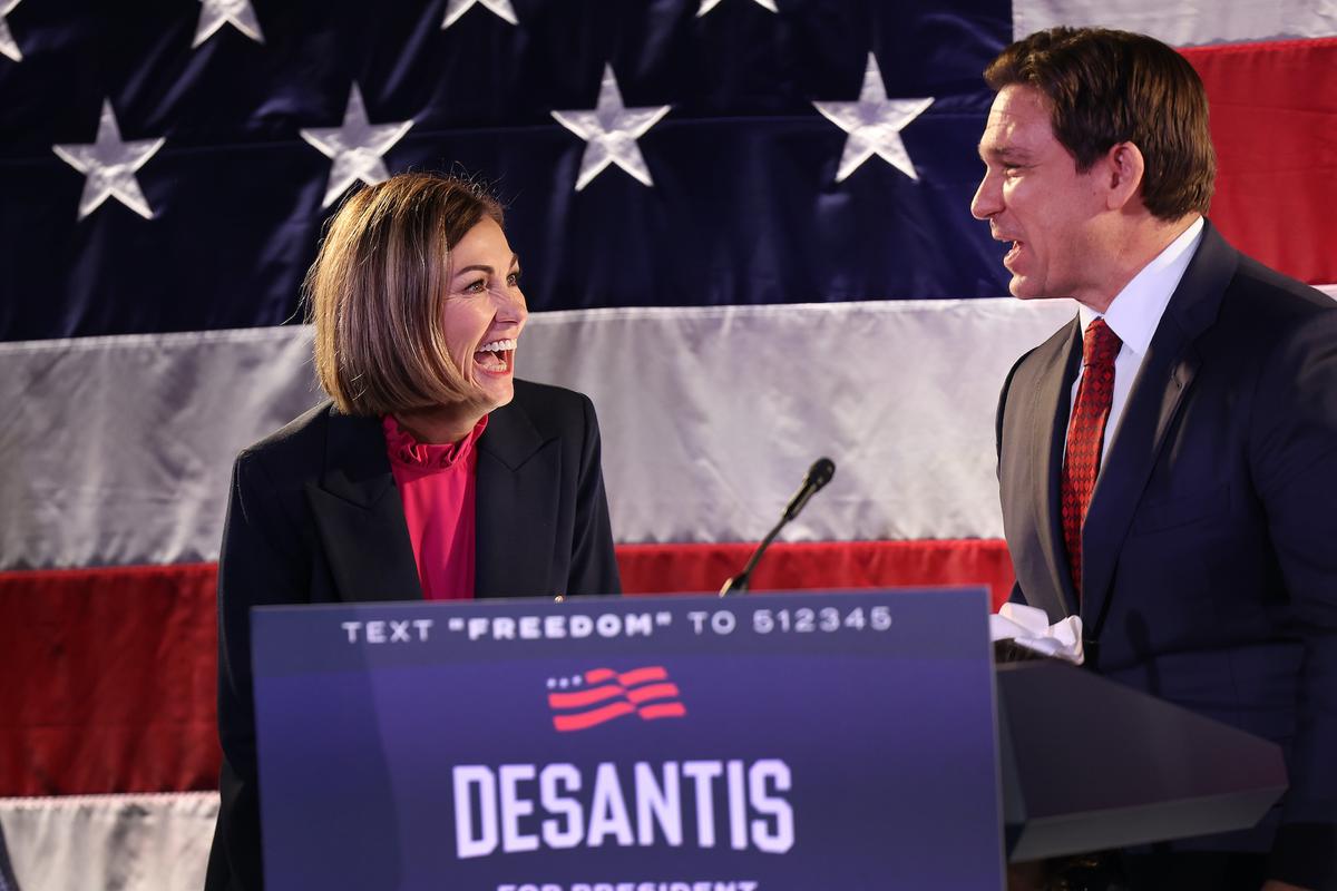 Republican presidential candidate Florida Gov. Ron DeSantis speaks with Iowa Gov. Kim Reynolds (L) during a campaign rally in Des Moines, Iowa, on Nov. 6, 2023. (Scott Olson/Getty Images)