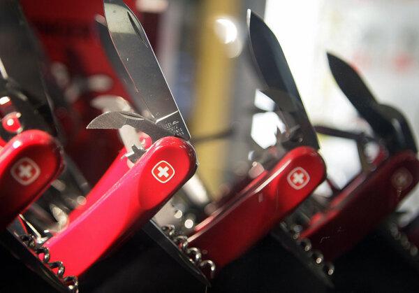 Swiss army knives are displayed in a shop in Montreux, Switzerland, on July 6, 2007. (Fabrice Coffrini/AFP via Getty Images)