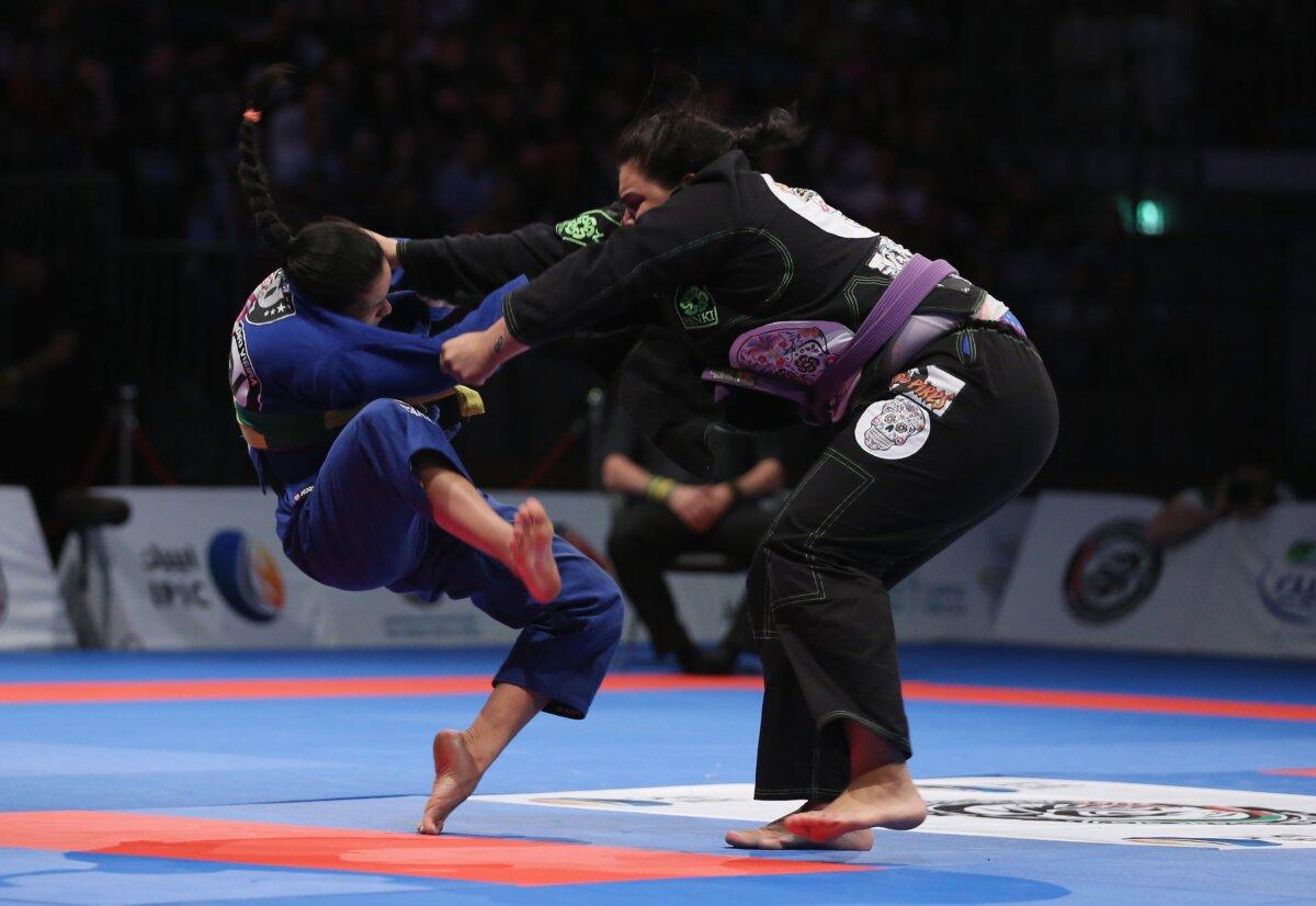 Tanya Araujo (R) of Brazil competes against Ana Carolina Srour of Brazil in the women's purple belt open weight finals during the Abu Dhabi World Professional Jiu-Jitsu Championship in the United Arab Emirates on April 19, 2014. (Francois Nel/Getty Images)