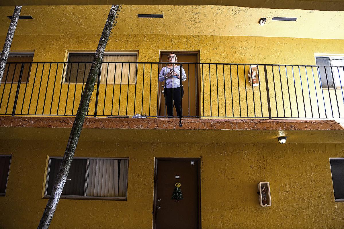 A woman outside her apartment, after an unannounced increase in rents, in Hialeah, Fla., on Jan. 18, 2022. (CHANDAN KHANNA/AFP via Getty Images)