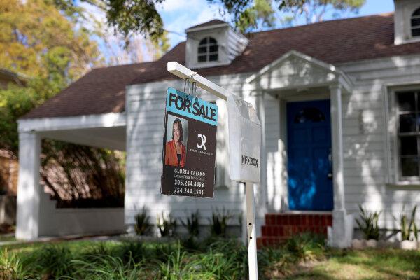 A For Sale sign displayed in front of a home in Miami, Florida, on Feb. 22, 2023. (Photo by Joe Raedle/Getty Images)