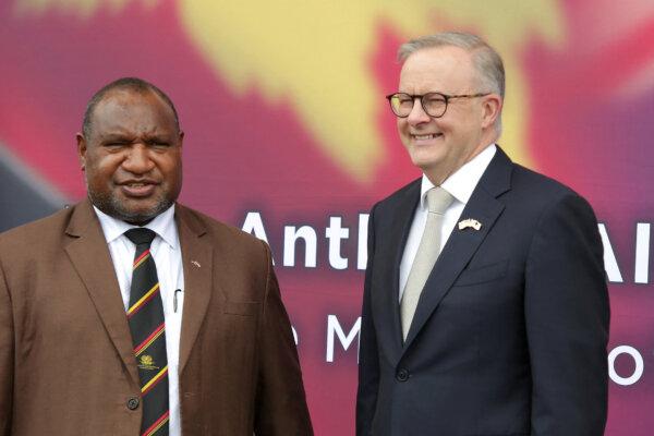 Papua New Guinea's Prime Minister James Marape (L) and his Australian counterpart Anthony Albanese pose for photos in Port Moresby, Papua New Guinea, on Jan. 12, 2023. (Andrew Kutan/AFP via Getty Images)