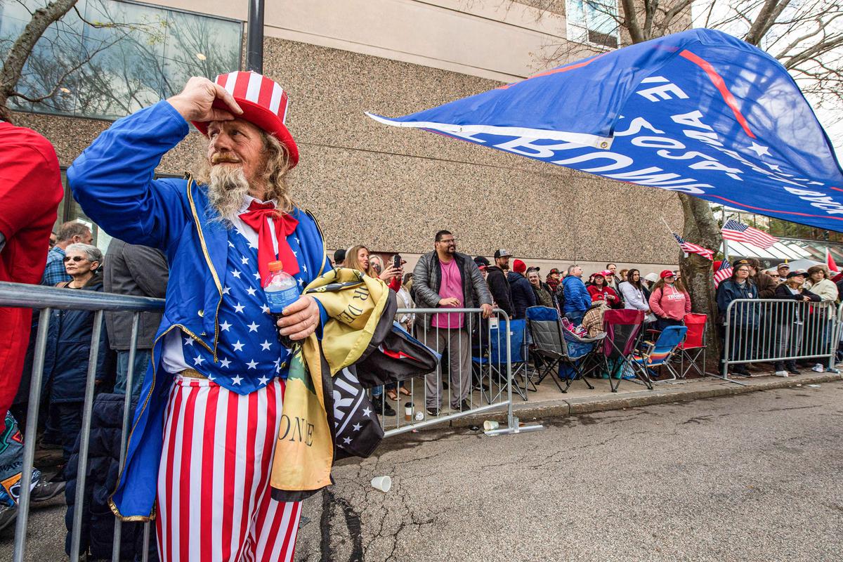 A person dressed as Uncle Sam waits in line at a Make America Great Again Rally with former President Donald Trump in Manchester, N.H., on April 27, 2023. (Photo by Joseph Prezioso / AFP) (Photo by JOSEPH PREZIOSO/AFP via Getty Images)