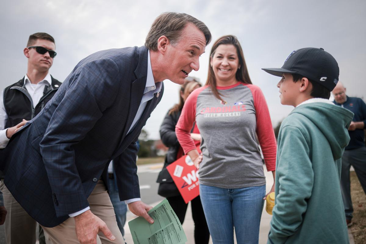 Virginia Gov. Glenn Youngkin greets voters and their children while campaigning at Piney Branch Elementary School in Bristow, Va., on Nov. 7, 2023. (Win McNamee/Getty Images)