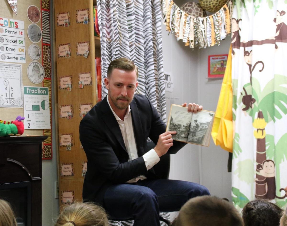Oklahoma State Superintendent Ryan Walters reads to children. (Courtesy of Ryan Walters)