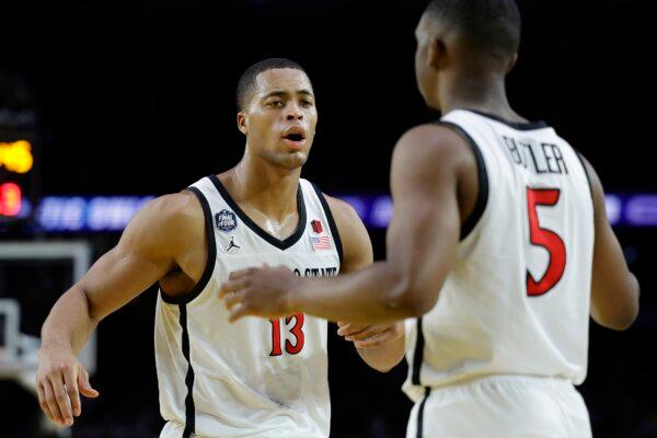 Jaedon LeDee (13) and Lamont Butler (5) of the San Diego State Aztecs react during the second half against the Florida Atlantic Owls during the NCAA Men's Basketball Tournament Final Four semifinal game in Houston on April 1, 2023. (Carmen Mandato/Getty Images)