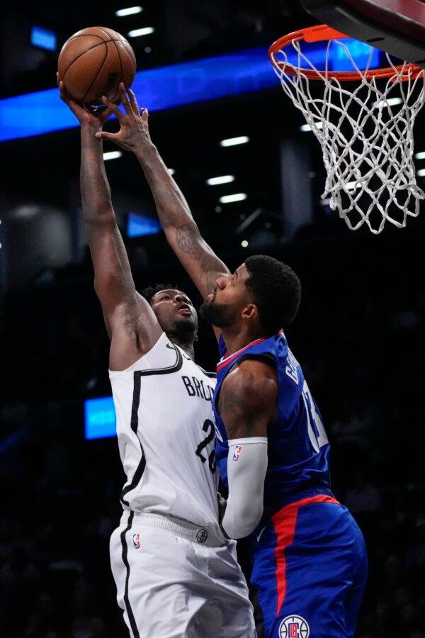 LA Clippers' Paul George (13) blocks a shot by Brooklyn Nets' Dorian Finney-Smith (28) during the first half of an NBA basketball game in New York on Nov. 8, 2023. (Frank Franklin II/AP Photo)