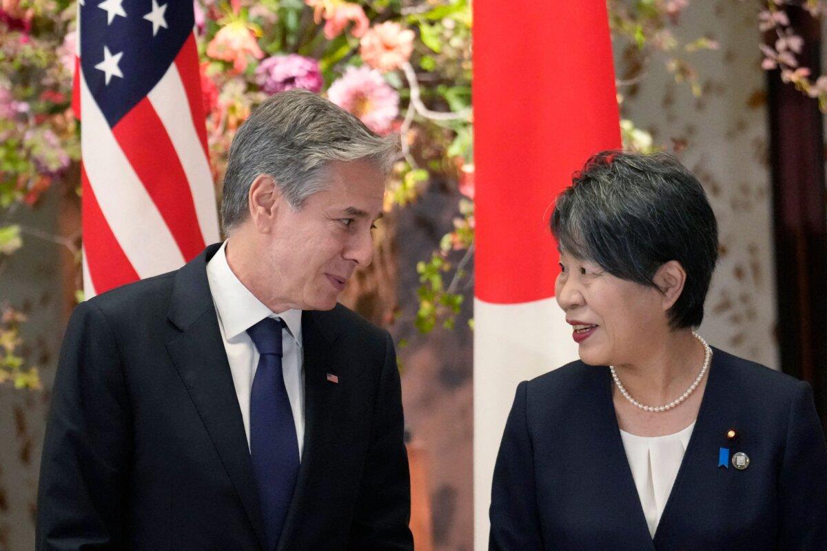 U.S. Secretary of State Antony Blinken (L) and Japanese Foreign Minister Yoko Kamikawa speak before a group photo session during their G7 foreign ministers' meetings in Tokyo on Nov. 8, 2023. (Eugene Hoshiko/POOL/AFP via Getty Images)