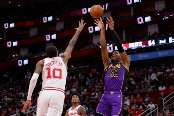 Rui Hachimura (28) of the Los Angeles Lakers shoots over Jabari Smith Jr. (10) of the Houston Rockets during the first half in Houston on Nov. 8, 2023. (Carmen Mandato/Getty Images)