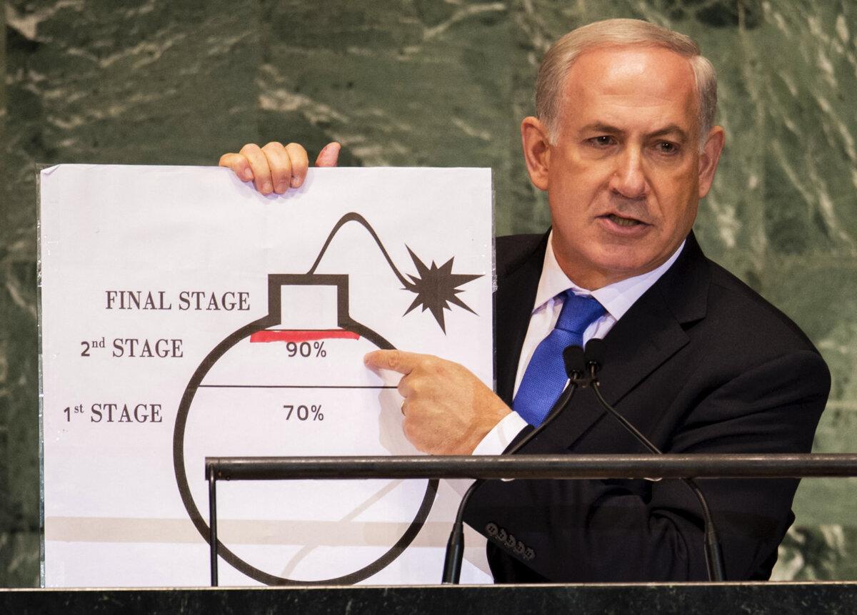 TOPSHOT - Benjamin Netanyahu, Prime Minister of Israel, uses a diagram of a bomb to describe Iran's nuclear program while delivering his address to the 67th United Nations General Assembly meeting on Sept. 27, 2012, at the United Nations in New York. (Don Emmert/AFP via Getty Images)